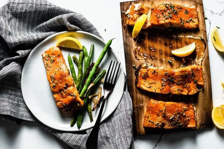BBQ Cedar Plank Salmon serving with salad 
