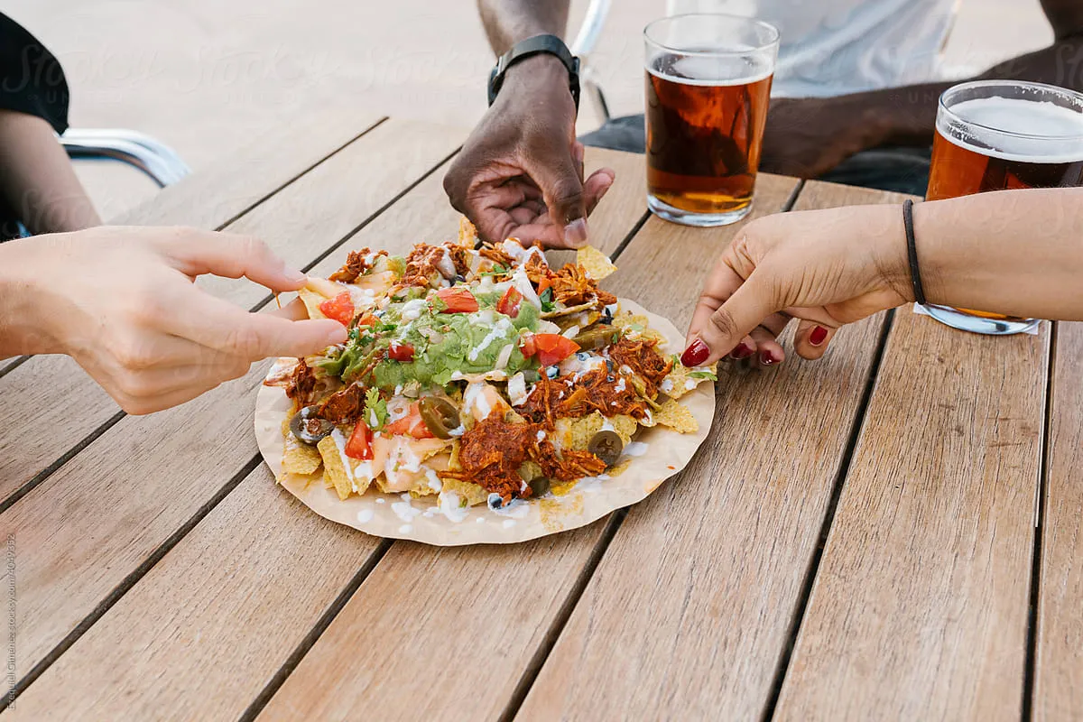 A cold, crisp beer like a lager or IPA pairs perfectly with BBQ smoked brisket nachos